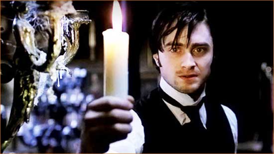 The Woman in Black Arthur Kipps (Daniel Radcliffe) shines a light on the mystery of "the Woman in Black".